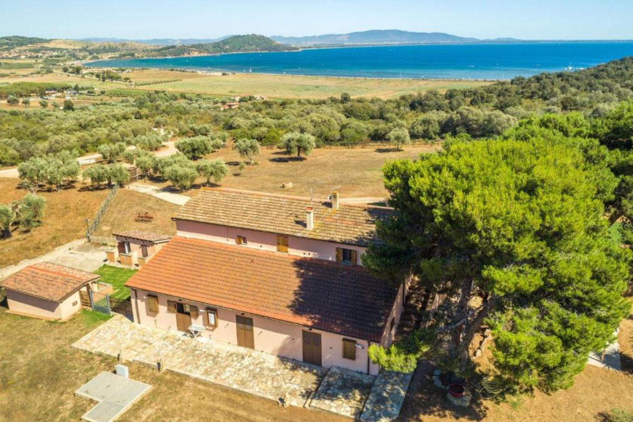 Aerial view of simple house with beautiful landscape and blue sea located at Podere Caprarecce Trilocale, Talomone