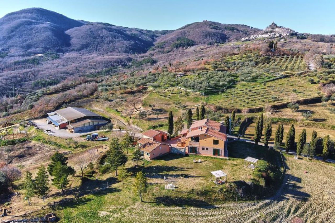 Aerial view of farmhouse with beautiful landscape located at the Il Cavalleggero