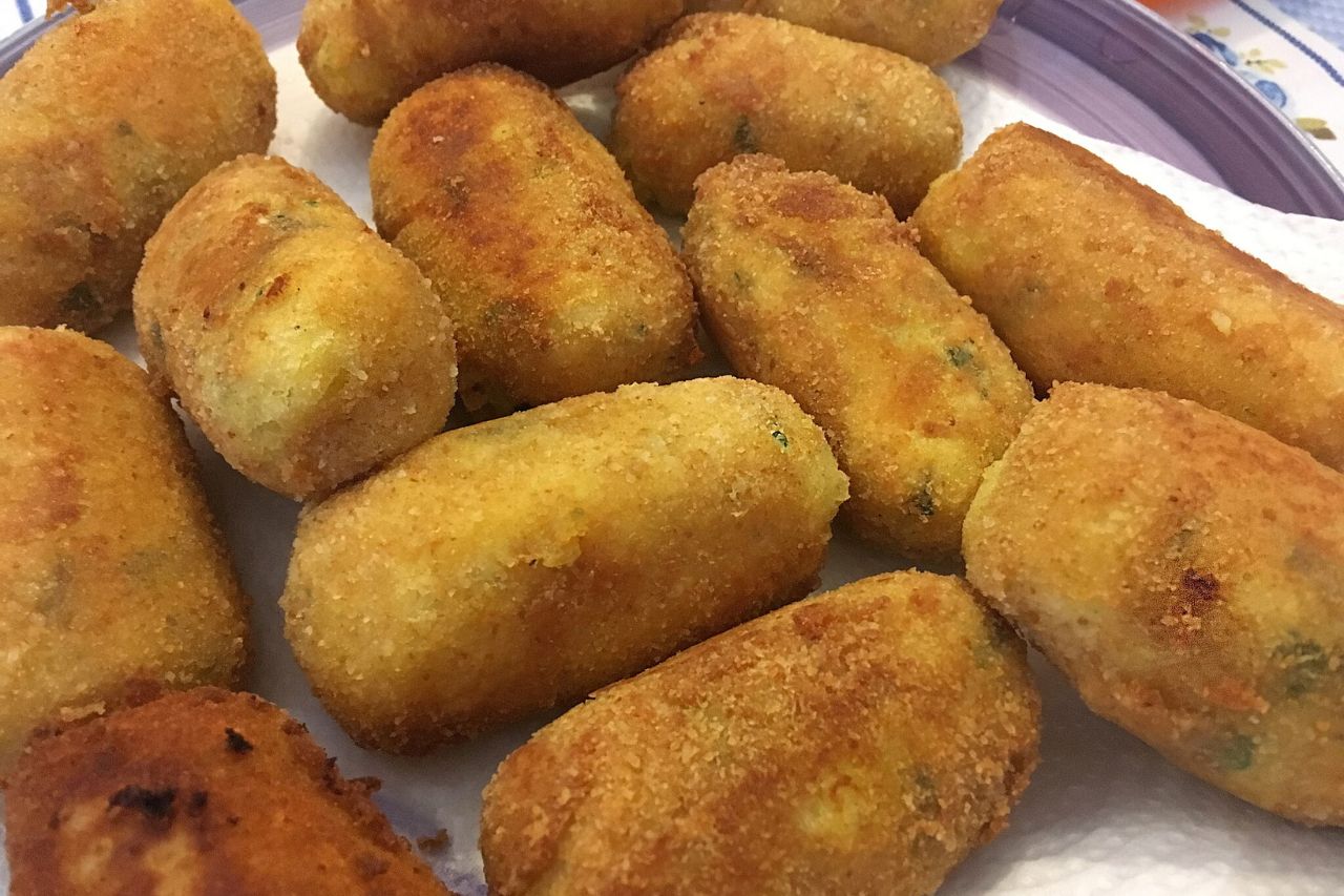 A plate of Panzarotti, South Italian deep-fried stuffed pastries, golden and crispy on the outside