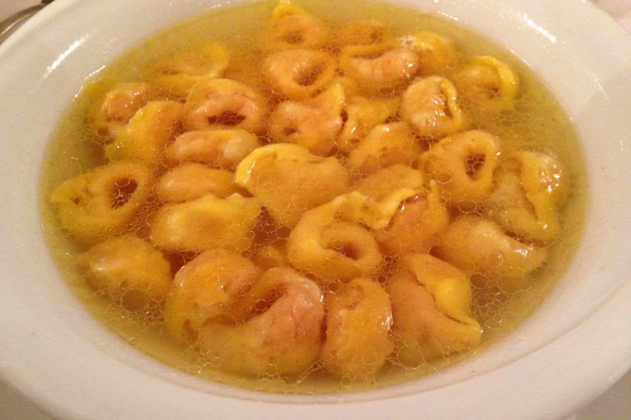 A bowl of Tortellini in Brodo, a North Italian dish featuring small pasta filled with meat 