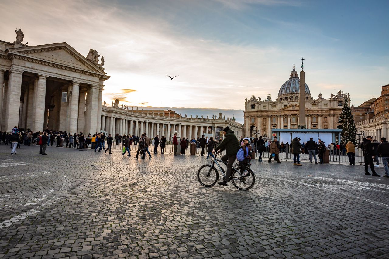 Vatican citizens stroll through the main square