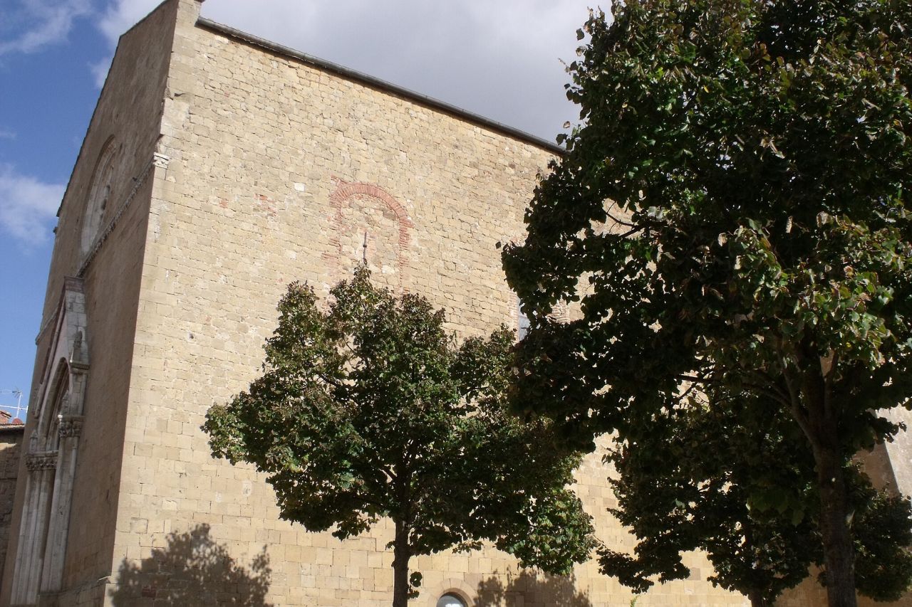 The main facade of Pieve dei Santi, in Monticchiello
