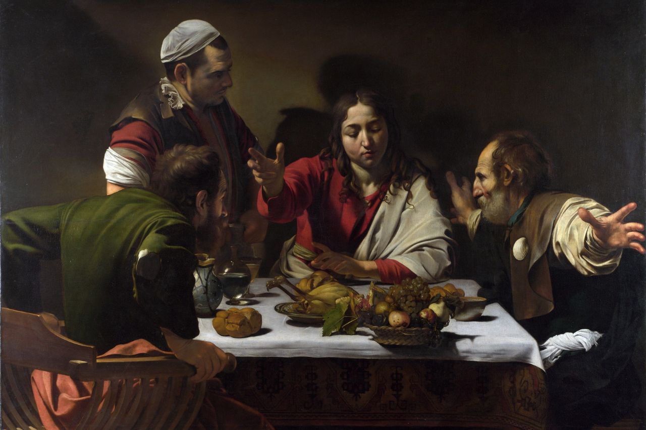 A beautiful painting by Caravaggio that portrays people having dinner in a typical restaurant of past centuries