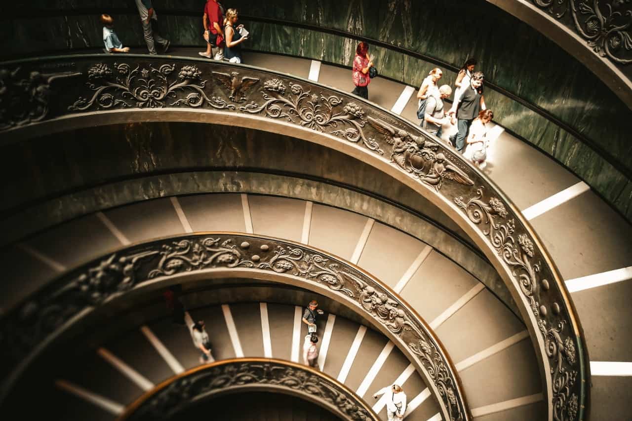 Tourists are exploring the Vatican museums, in Rome