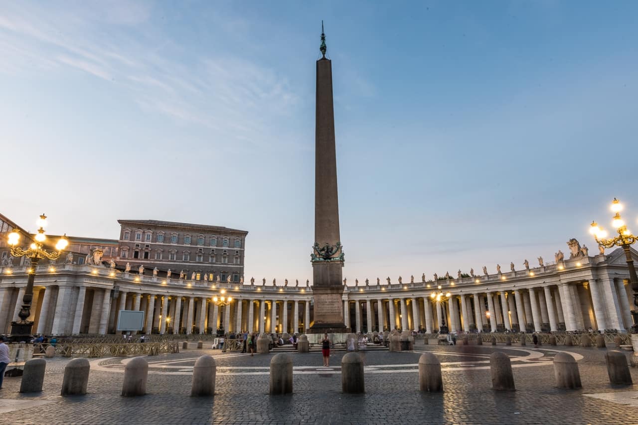 The Vatican obelisk is photographed by tourists