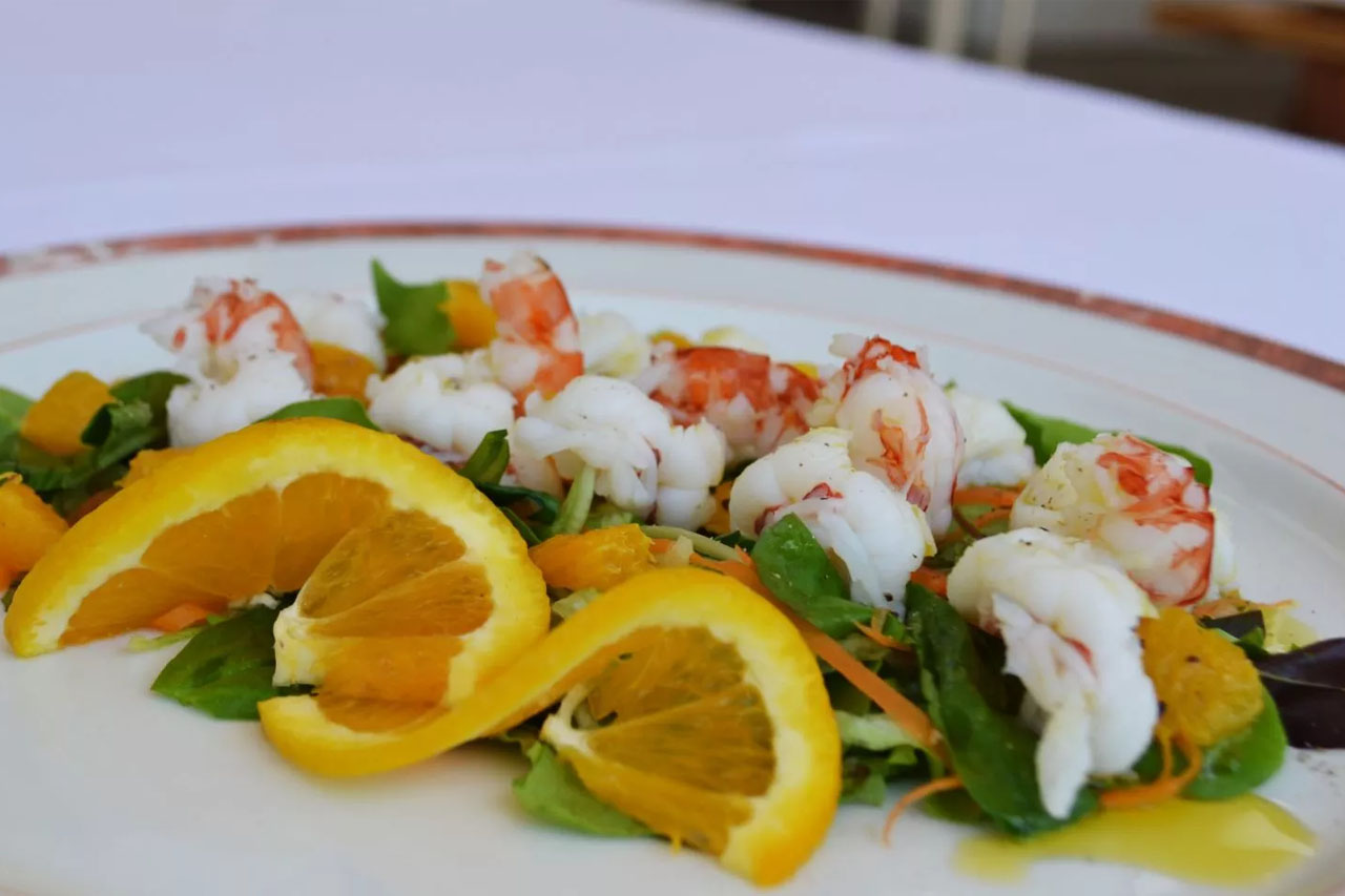 Seafood dish with lemon served by L’Antica Trattoria