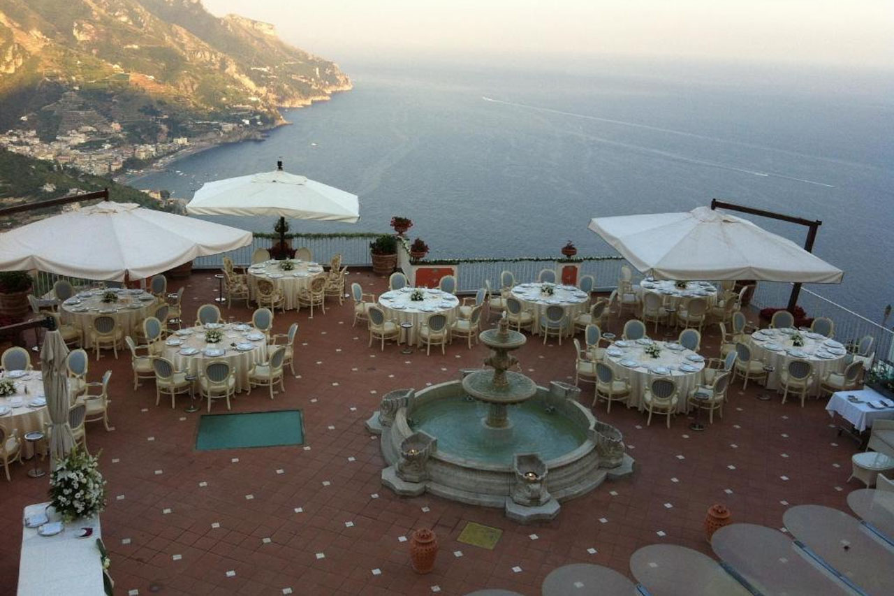 Dining table on the terrace of Hotel Villa Fraulo with a stunning view.