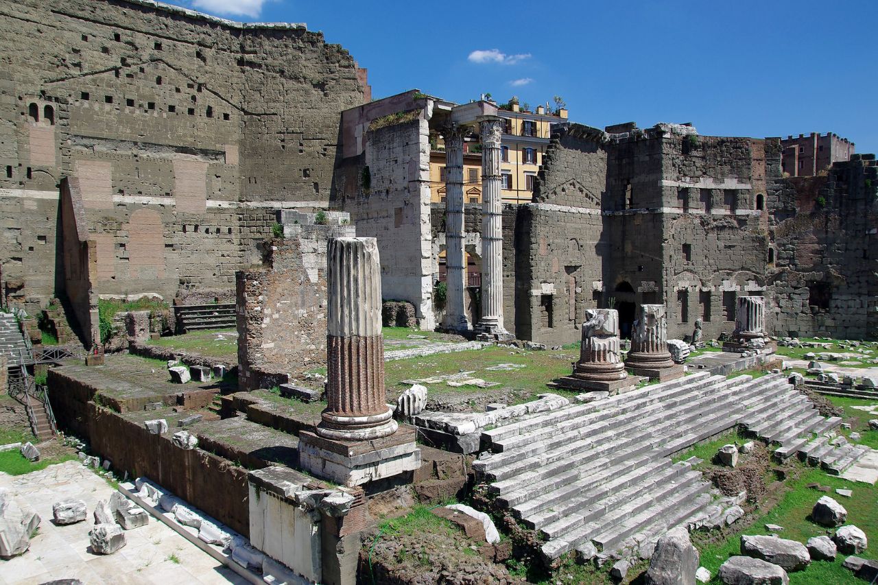 The beautiful Forum of Augustus, with tourists photographing the archaeological finds