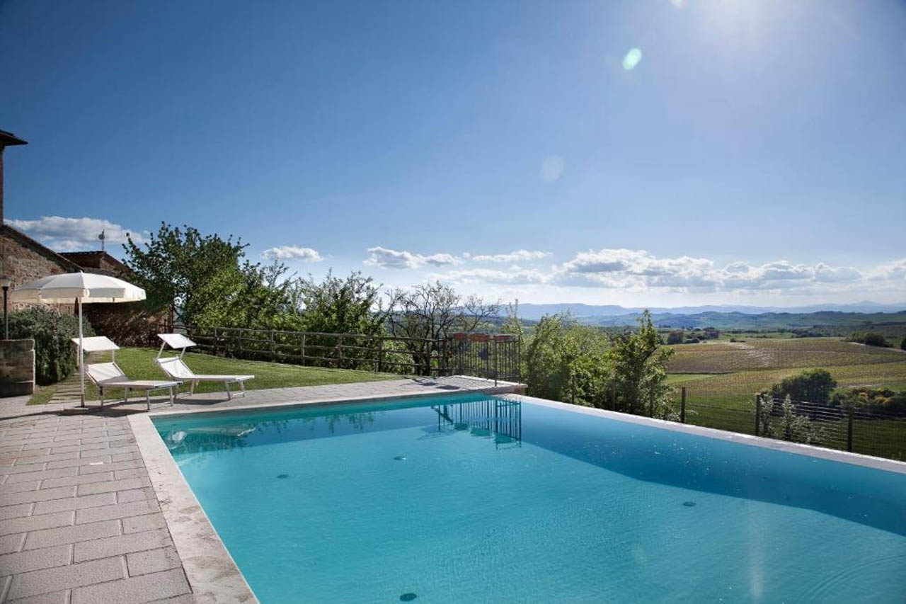 Outdoor pool with beautiful view landscape in Agriturismo Palazzo Massaini "Cavarciano"