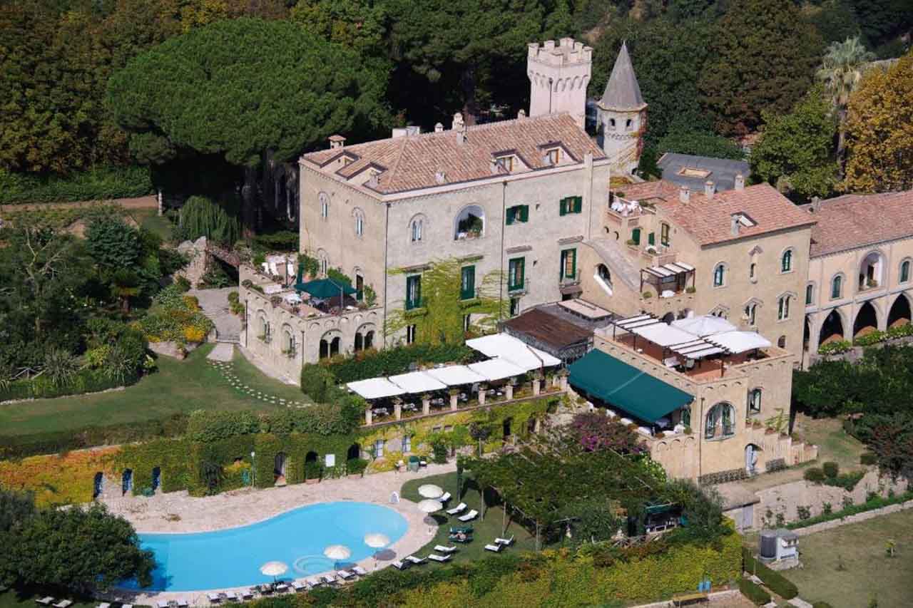 Aerial view of the castle with large outdoor pool in Hotel Villa Cimbrone
