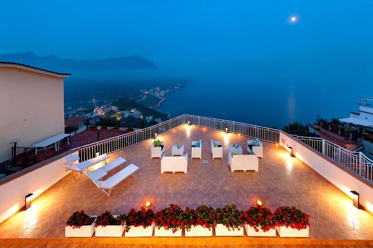 Aerial view of rooftop during nighttime with an overlooking view of the sea in Gala Residence Villa Giovanna 