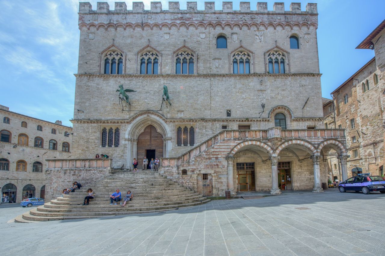 Tourists are visiting the Palazzo dei Priori in Perugia