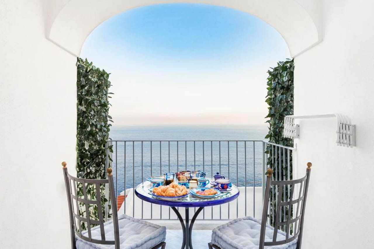 Overlooking the beautiful sea from the balcony in La Divina Amalfi Coast, Praiano