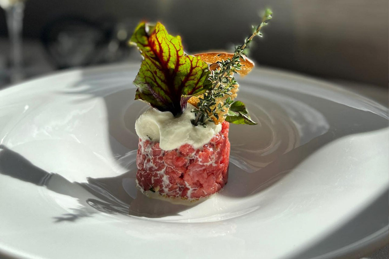 A delicious Fassona beef tartare with hazelnuts served by the Ambrosia Rooftop Restaurant & Bar