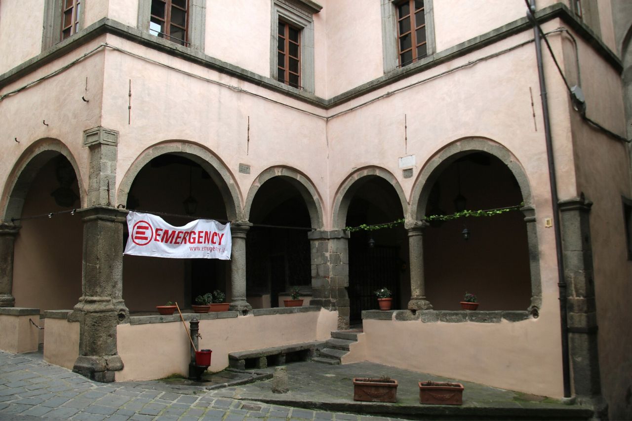 View of the Palazzo Nerucci from the outside with an emergency banner, in Castel del Piano